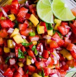 Close up of the strawberry mango salsa, showing the bits of onion and cilantro.