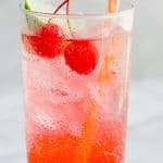 Bubbly and cold Cherry Limeade with a straw.