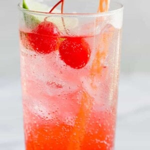 Bubbly and cold Cherry Limeade with a straw.