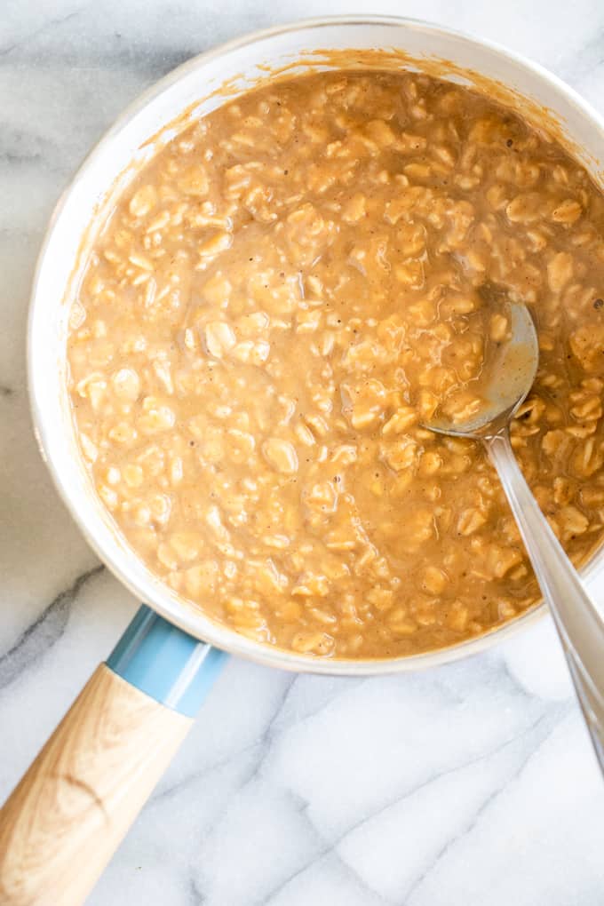 A pot filled with cooked pumpkin pie oatmeal.