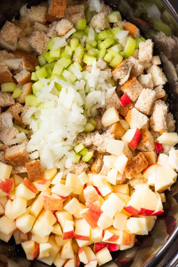 Ingredients in a slow cooker to make slow cooked stuffing.