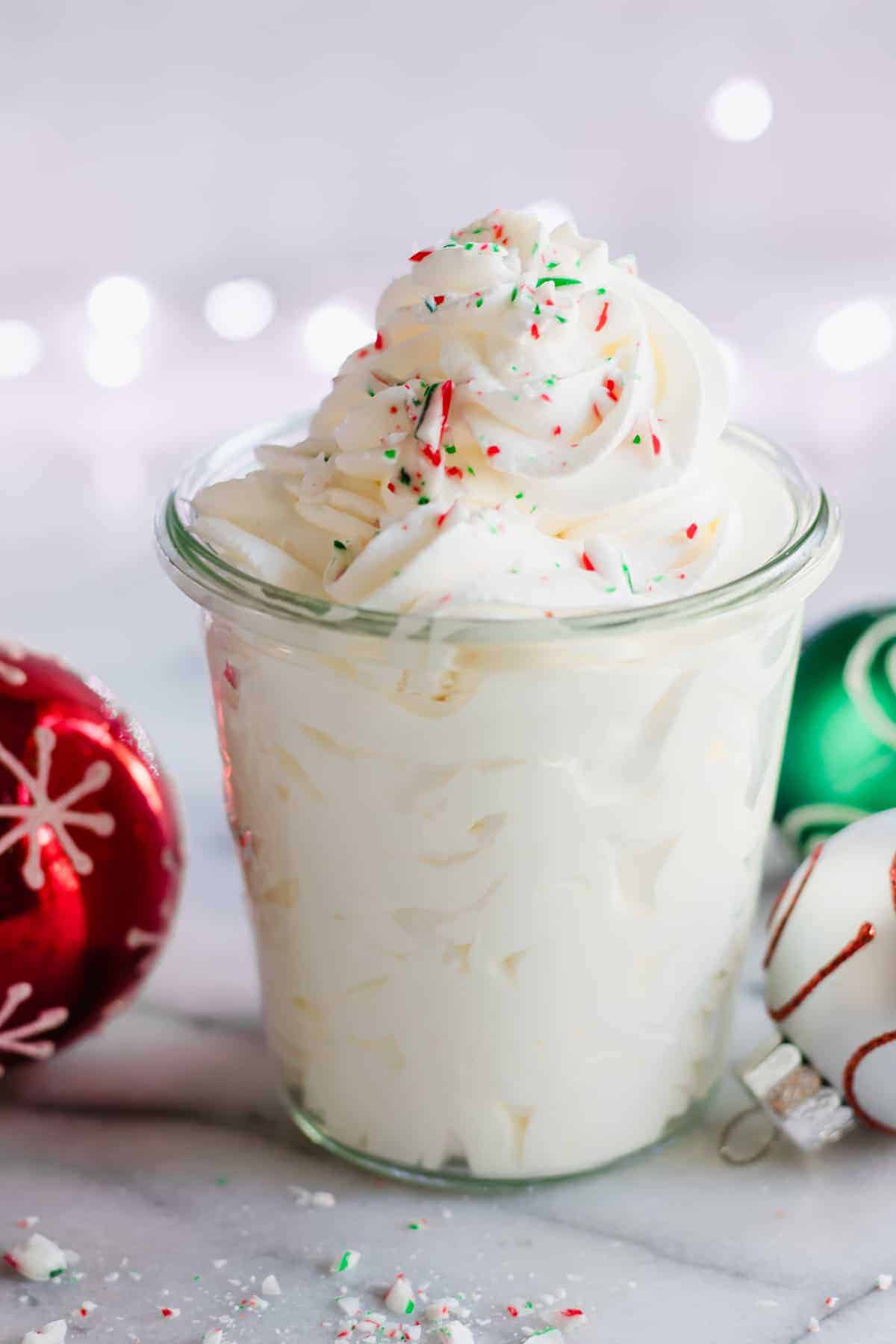 Peppermint Whipped Cream, only three ingredients, super easy, and delightfully minty!  Perfect on top of any hot drink, or just to eat with a spoon.  