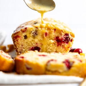 Cranberry orange bread with orange glaze drizzle.