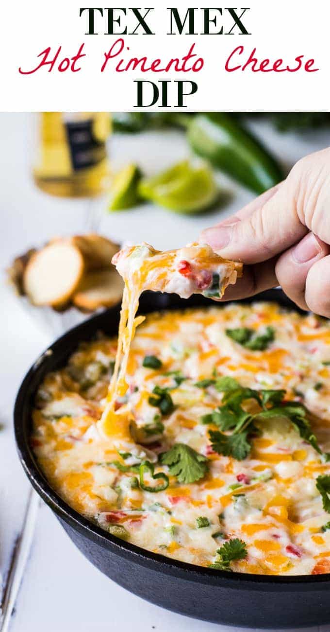 Tex Mex style Hot Pimento Cheese Dip is the ultimate in hot cheese dip recipes! Loaded with sweet pimento peppers, jalapeños, cumin, and topped with some cilantro. This cheese dip is sure to disappear FAST! 