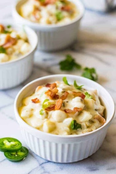 Jalapeño Bacon Hominy is ULTIMATE comfort food. This easy to make super creamy white cheddar hominy is loaded with bacon and jalapeño for extra flavor and heat. Perfect side dish!