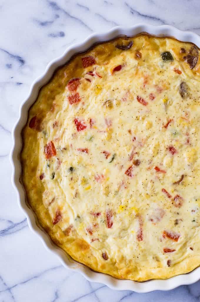 Make an EASY and delicious bacon & roasted jalapeño quiche for breakfast or brunch. Bursting with flavor and a little heat.