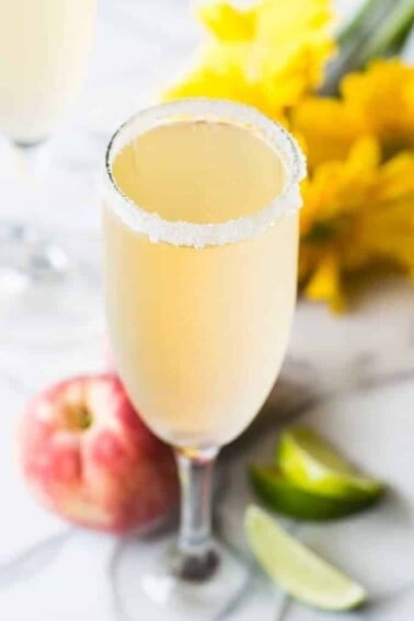 The perfect brunch cocktail! A mixture of a bellini and margarita! Made with peach juice, tequila, and champagne!