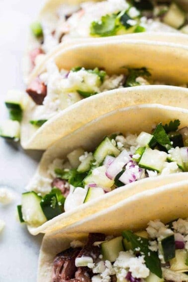 Spicy Habanero Grilled Lamb liven up these tacos, that are a perfect blend of Mexican and Mediterranean flavors! Cool and creamy mojito cole slaw, cucumber salsa, and queso fresco complete the dish! Perfect recipe for grilling season!
