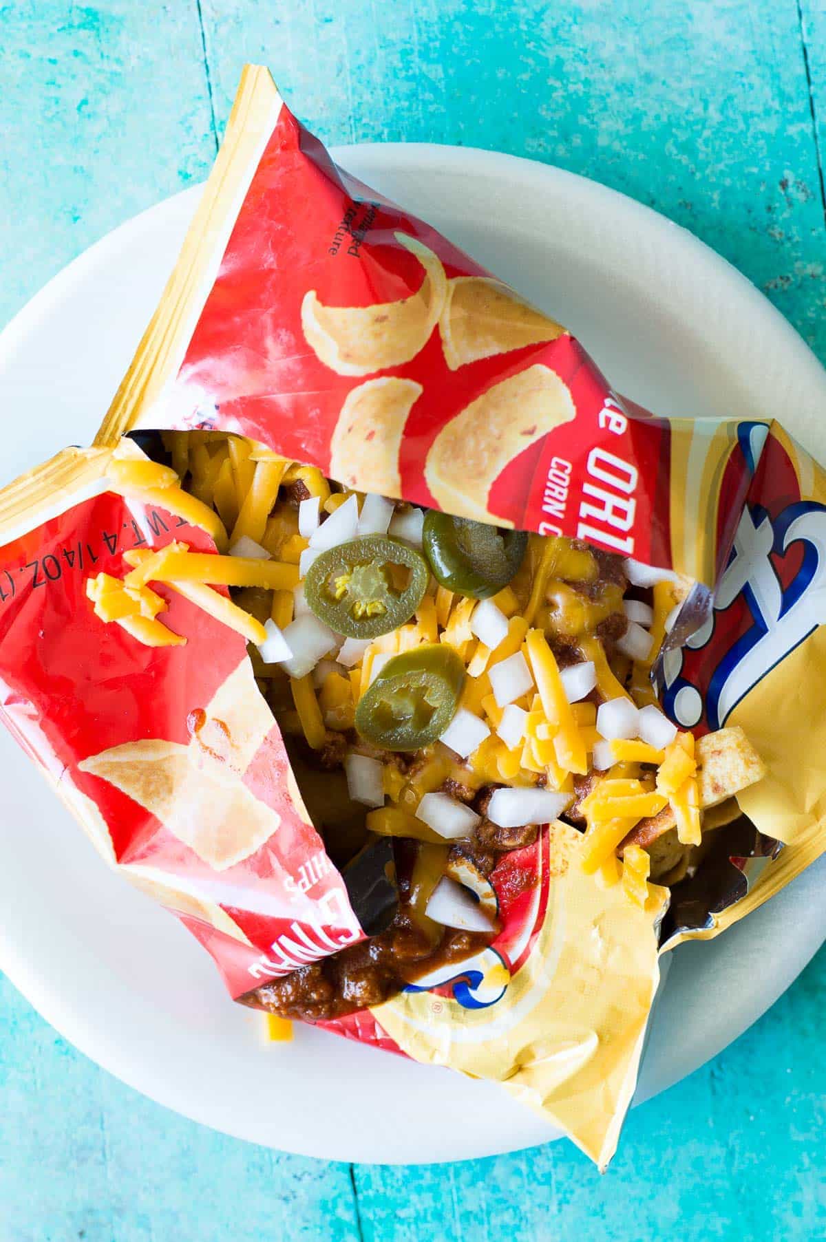 20 Minute Texas Style Chili! This Texas style chili is bursting with meat and spice, and only takes 20 minutes to come together. And this is the ideal chili to have on a Frito Pie!! Perfect for gamedays or family dinner!