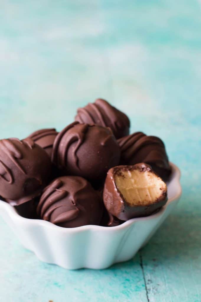 Bowl filled with pumpkin spice truffles. 