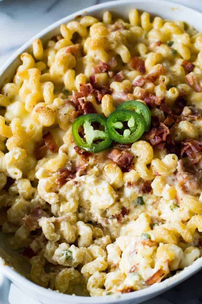 Jalapeno Popper Macaroni and Cheese! This macaroni and cheese tastes just like a jalapeño popper!! Loaded up with fresh jalapeño. Bits of crispy bacon. And the homemade sauce is made ultra creamy by adding cream cheese! You will never want another macaroni and cheese again once you try this one!