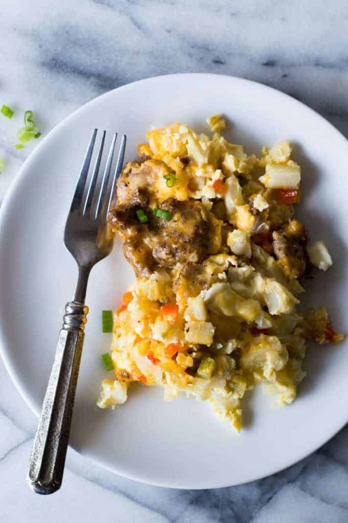 Slow Cooker Breakfast Casserole. This quick and easy to put together breakfast can cook in the slow cooker overnight while you're sleeping!! There's nothing better than waking up to the smell of a homemade breakfast already made. This casserole is loaded up with sausage, diced hash browns, eggs and cheese.