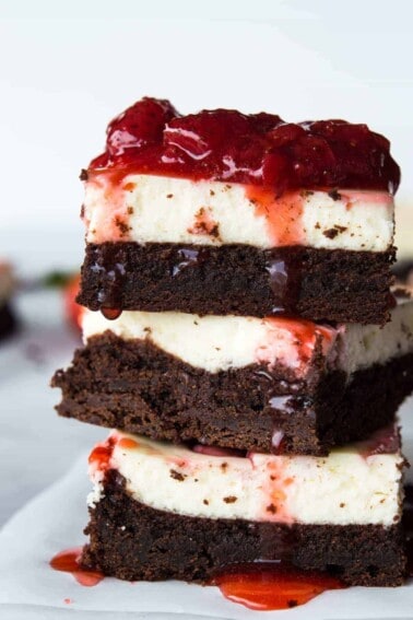 Strawberry Cheesecake Brownies. These homemade brownies are loaded up with a layer of creamy cheesecake then swirled with a sweet strawberry sauce for a pop of color and flavor! Spoon the extra strawberry sauce over the top for an extra special dessert!