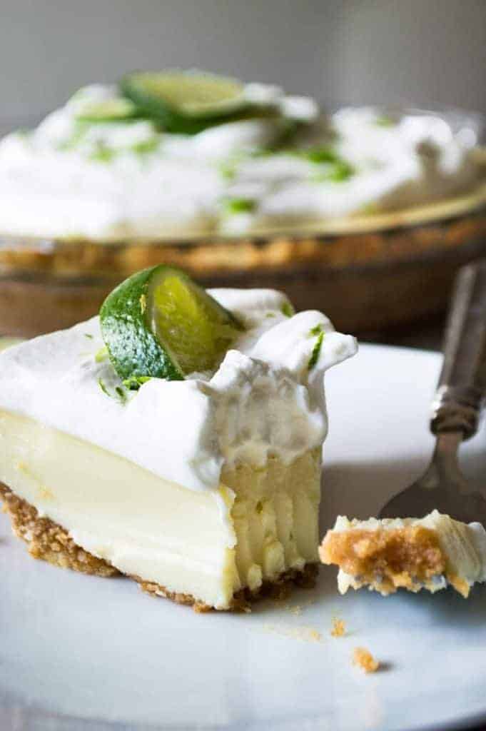 Tequila Lime Pie! An ultra creamy, lime pie laced with a hint of tequila! Almost like enjoying a bite of margarita! 