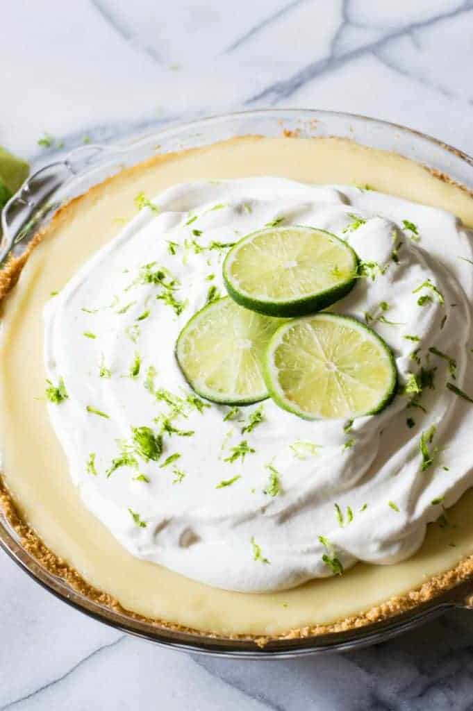 Tequila Lime Pie! An ultra creamy, lime pie laced with a hint of tequila! Almost like enjoying a bite of margarita! 