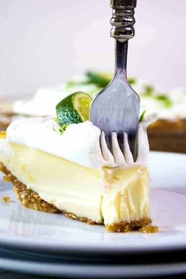 Tequila Lime Pie! An ultra creamy, lime pie laced with a hint of tequila! Almost like enjoying a bite of margarita!