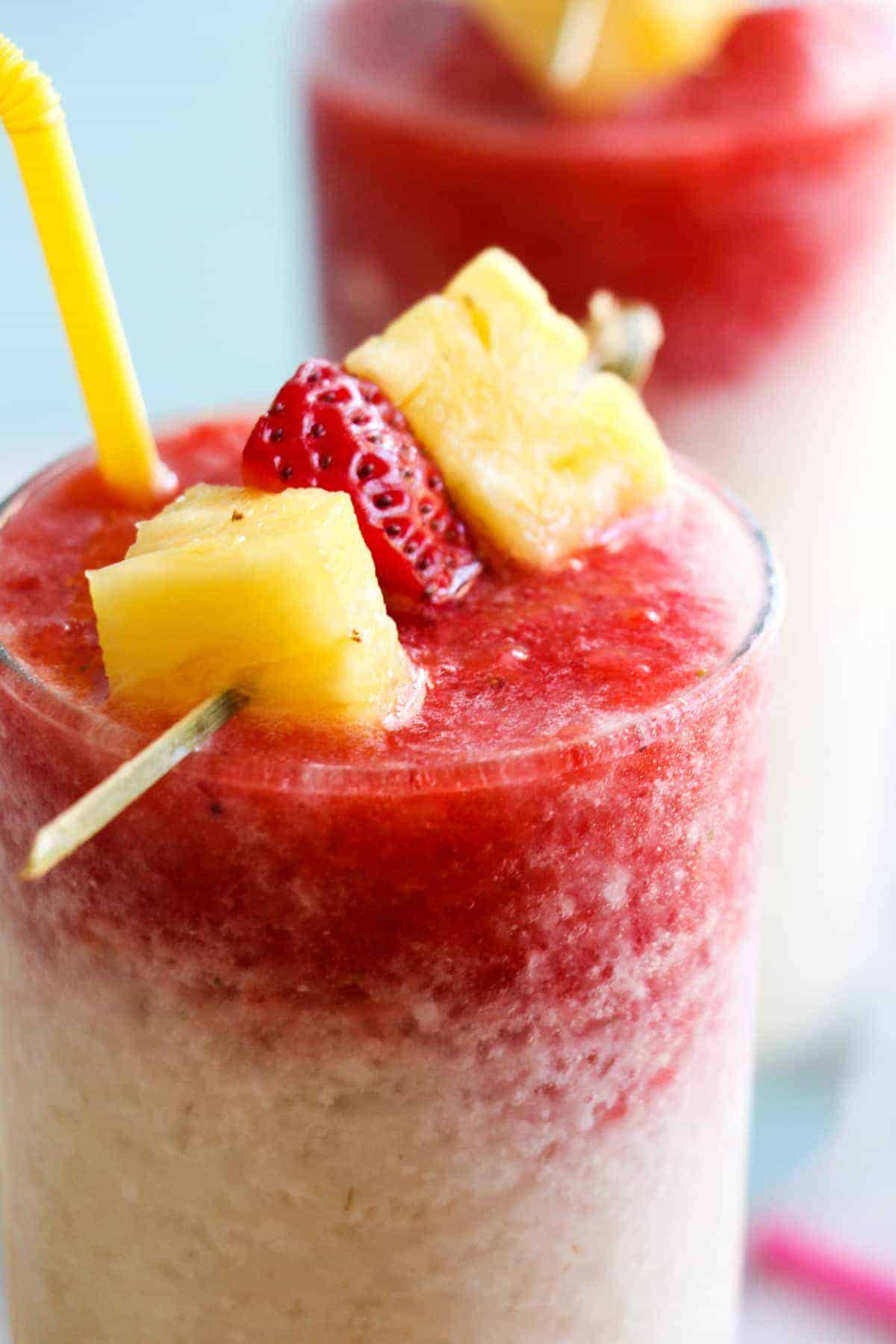 Virgin Lava Flow Slush! Enjoy the tropical flavors of pineapple, coconut and banana swirled with strawberry in this frosty and slushy drink! Feel free to add a little rum if desired! The perfect summertime drink!