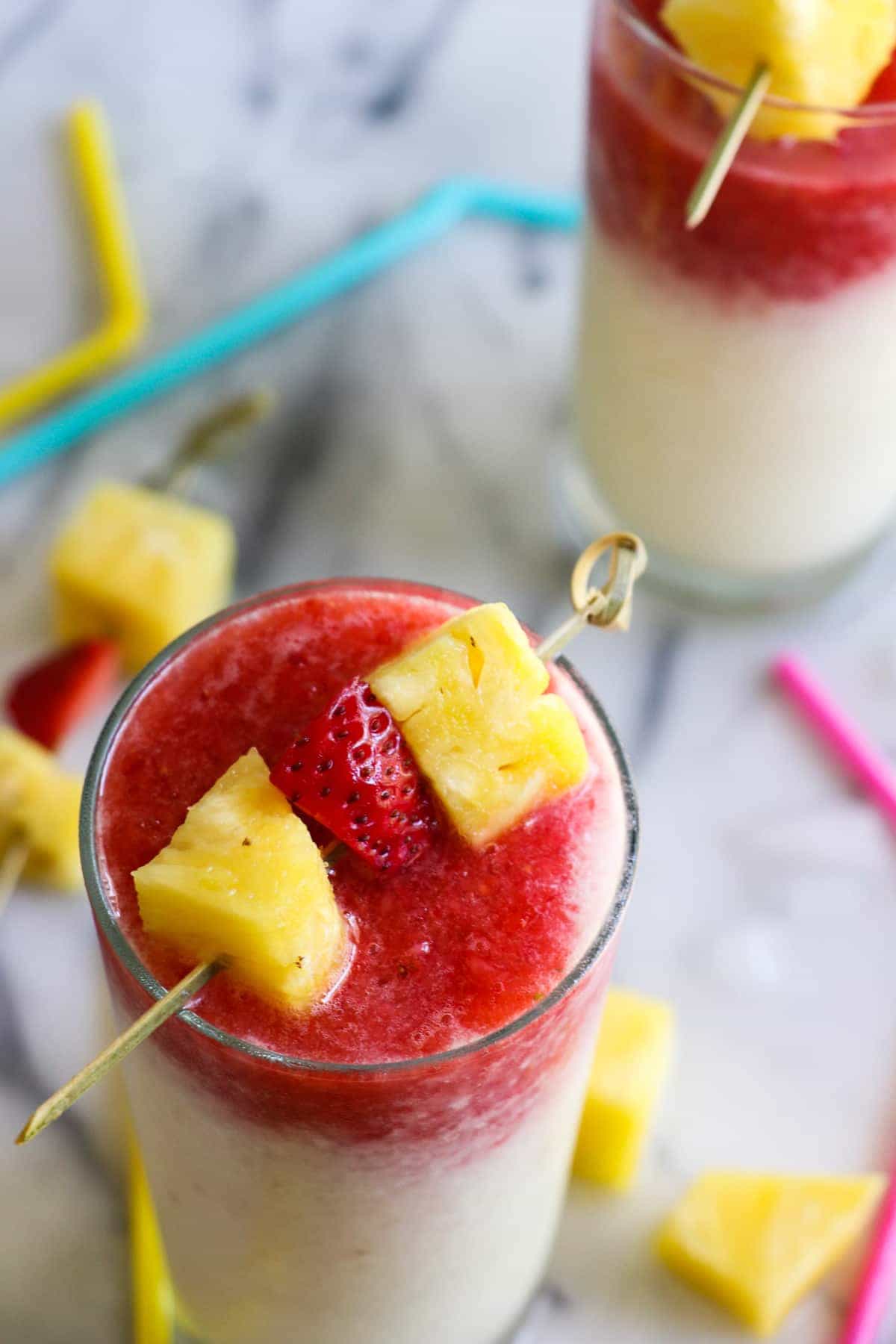 Virgin Lava Flow Slush! Enjoy the tropical flavors of pineapple, coconut and banana swirled with strawberry in this frosty and slushy drink! Feel free to add a little rum if desired! The perfect summertime drink!