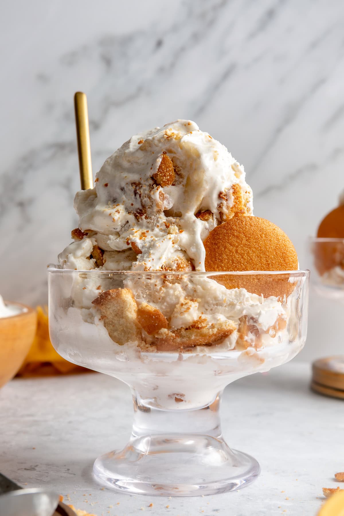 Banana pudding ice cream served in a glass dish.