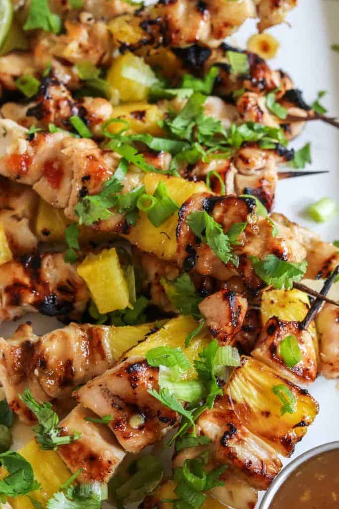 Sweet Chili Grilled Chicken and Pineapple!  Chicken marinated in a flavorful sweet chili sauce made with simple ingredients.  Grilled with chunks of pineapple for a sweet and spicy summer time meal! 