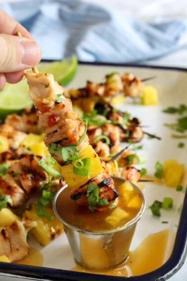 Sweet Chili Grilled Chicken and Pineapple!  Chicken marinated in a flavorful sweet chili sauce made with simple ingredients.  Grilled with chunks of pineapple for a sweet and spicy summer time meal! 