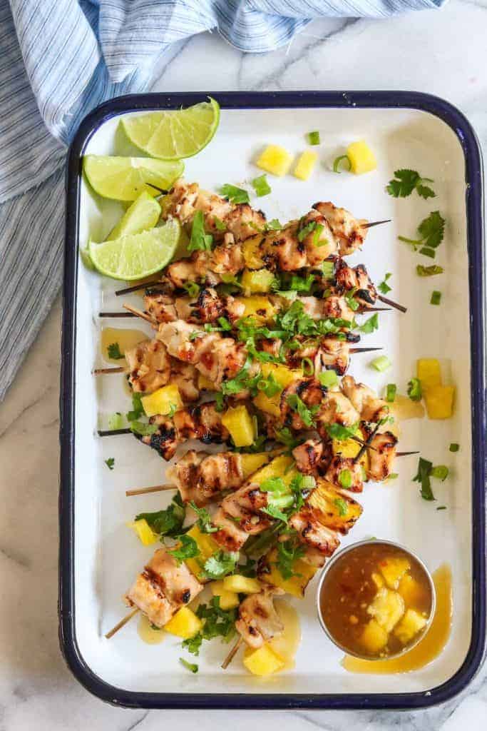 Sweet Chili Grilled Chicken and Pineapple!  Chicken marinated in a flavorful sweet chili sauce made with simple ingredients.  Grilled with chunks of pineapple for a sweet and spicy summer time meal! 