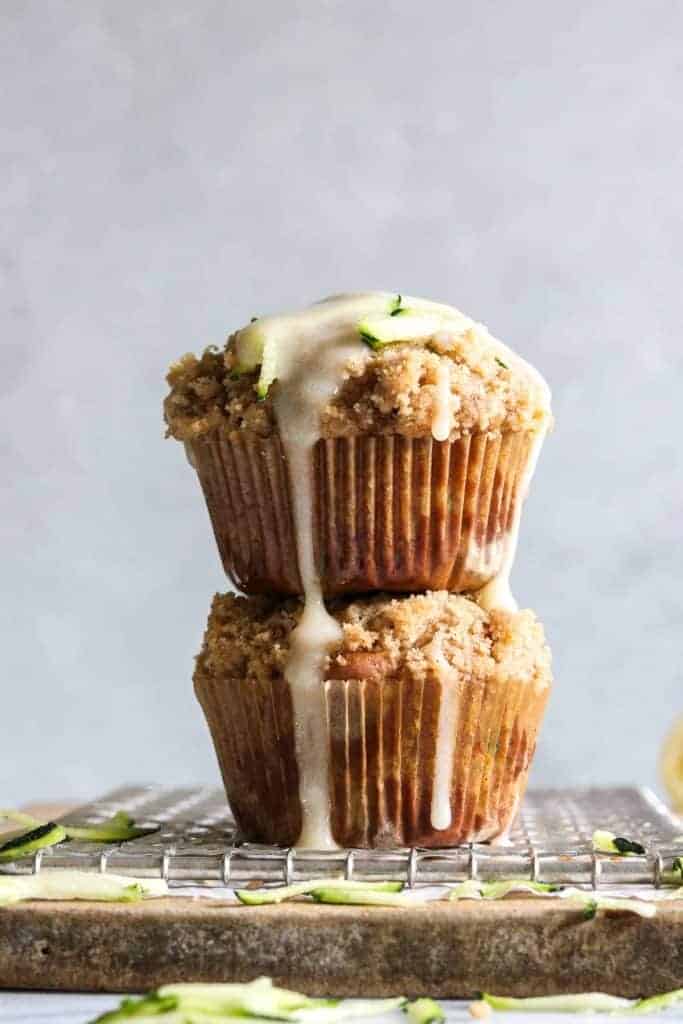 Zucchini Crumb Muffins with Lemon Cream Cheese Glaze.  These muffins are loaded up with fresh zucchini, spiced up with a hint of cinnamon, and made lighter by using greek yogurt!  Not to mention the sweet hint of crumb topping baked right into the muffin.  Top it all off with a drizzle of lemon cream cheese glaze. 
