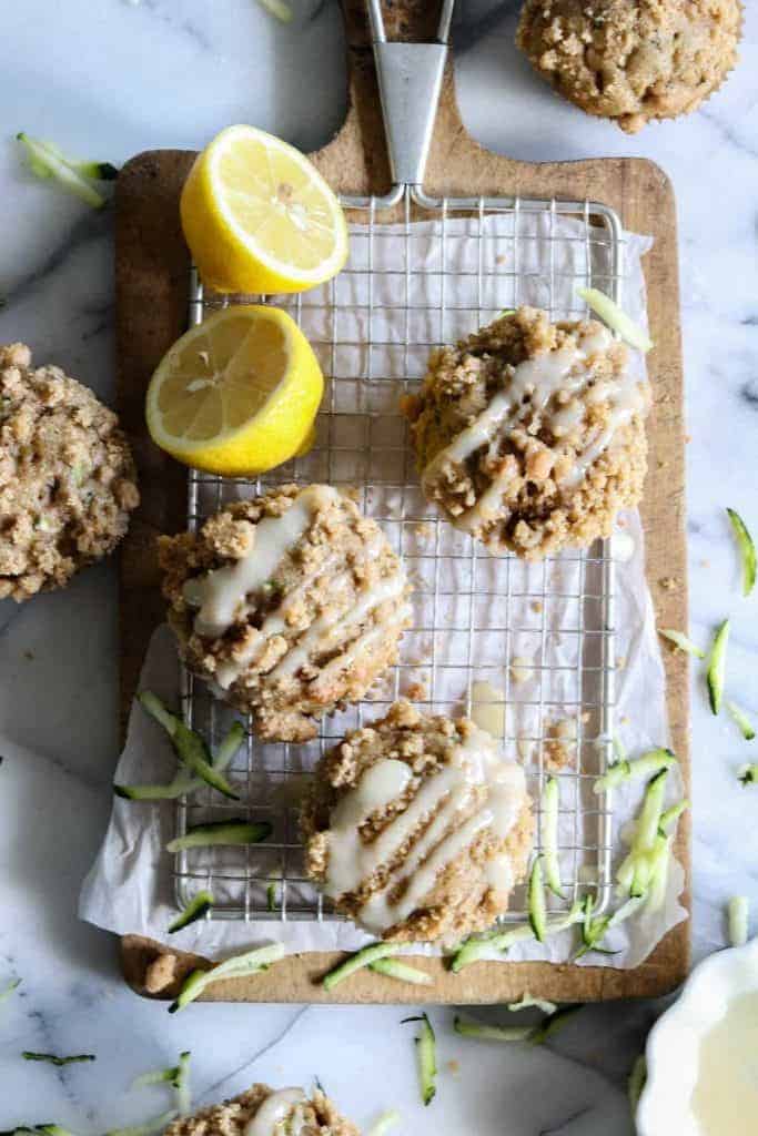 Zucchini Crumb Muffins with Lemon Cream Cheese Glaze.  These muffins are loaded up with fresh zucchini, spiced up with a hint of cinnamon, and made lighter by using greek yogurt!  Not to mention the sweet hint of crumb topping baked right into the muffin.  Top it all off with a drizzle of lemon cream cheese glaze. 