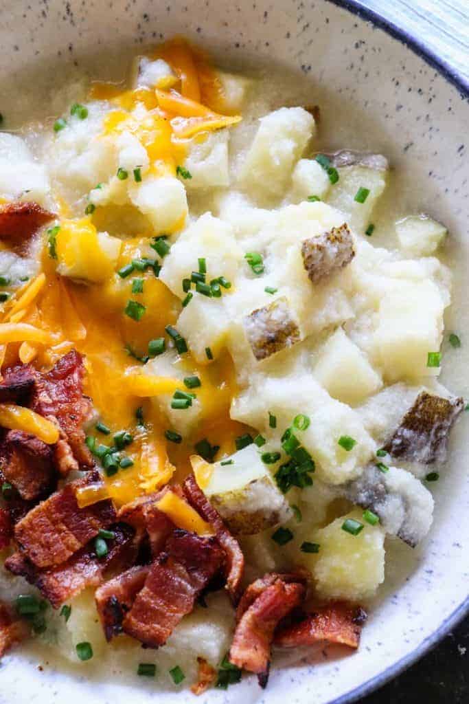 This Potato Soup is smooth and creamy. Loaded with chunks of potato. Plus it's secretly healthy, made with no milk or cream! 