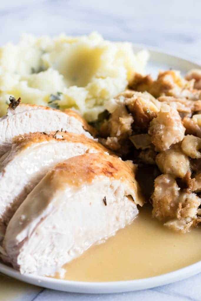 Tender and juicy turkey perfect for Thanksgiving day. Plus instructions on how to make turkey stock, gravy and stuffing too! 