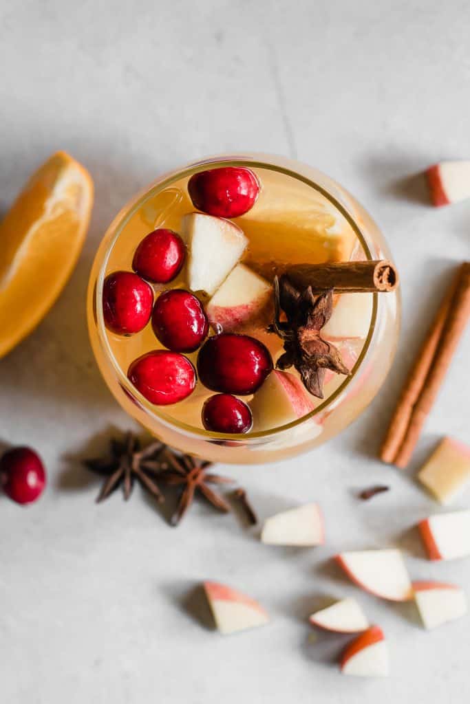Sparkling Apple Cider Sangria. Sparkling Apple cider loaded up with chunks of apple, orange, cranberries, and all the best fall spices. No alcohol included makes this perfect for the entire family! 