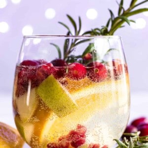 Sparkling White Sangria. This festive drink is super easy to put together and definitely makes a statement. Loaded with cranberries, pears, and oranges this drink is perfect for celebrating the Holidays! 
