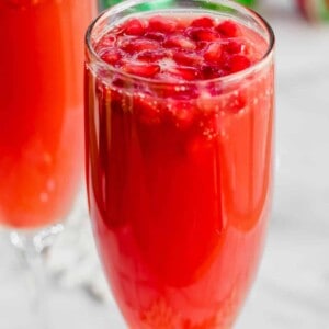 Christmas Mimosas! Celebrate Christmas in the morning with this mimosa that has a combination of orange juice and pomegranate juice! 