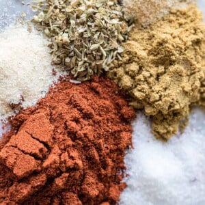 Measured out spices prepared to mix for homemade taco seasoning.