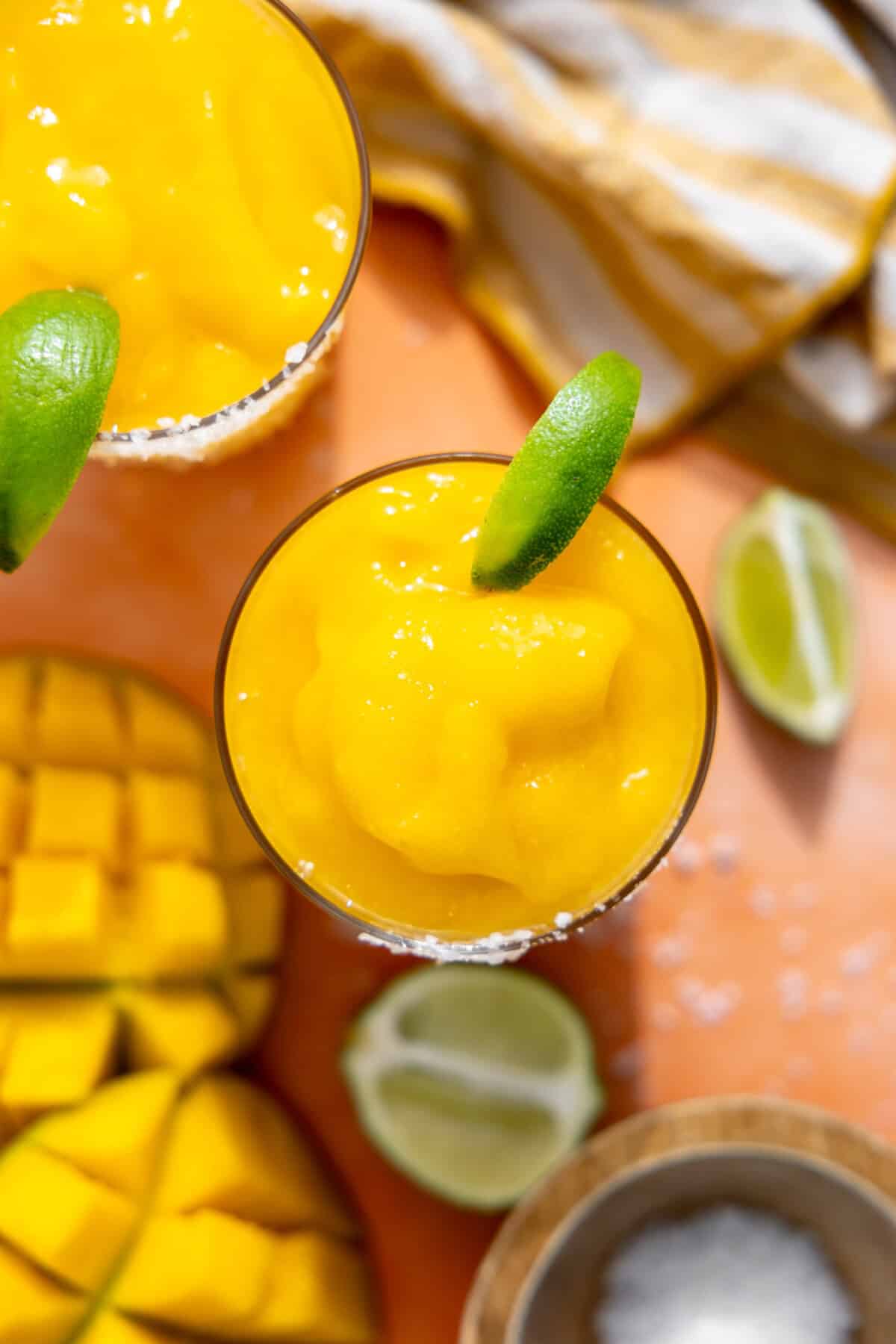 Overhead of frozen mango margarita showing creamy texture.