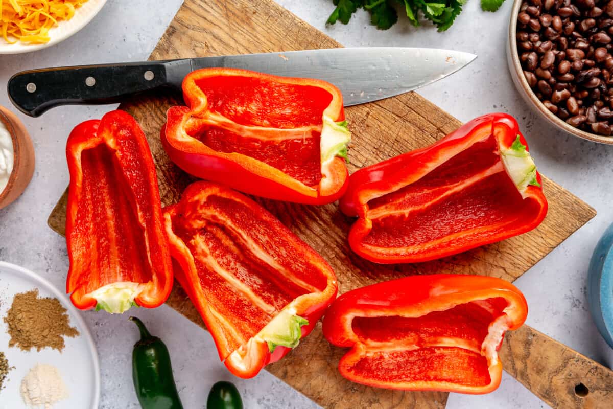 Bell peppers sliced in half with seeds removed. 
