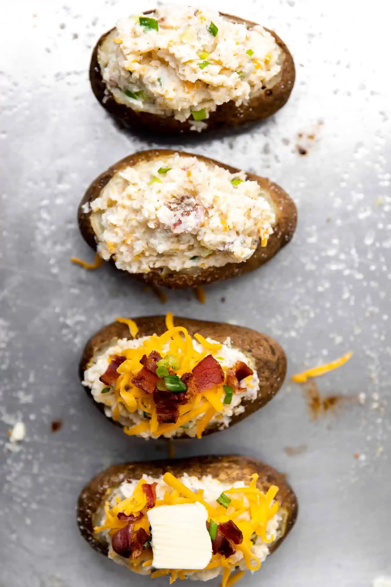 Potatoes stuffed with mashed potatoes ready to bake for twice baked potatoes. 