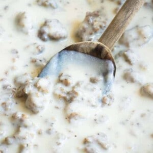 Spoon dipping into homemade sausage gravy.