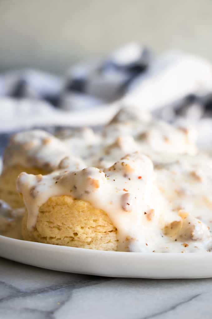 Plate full of biscuits and gravy made with homemade sausage gravy. 
