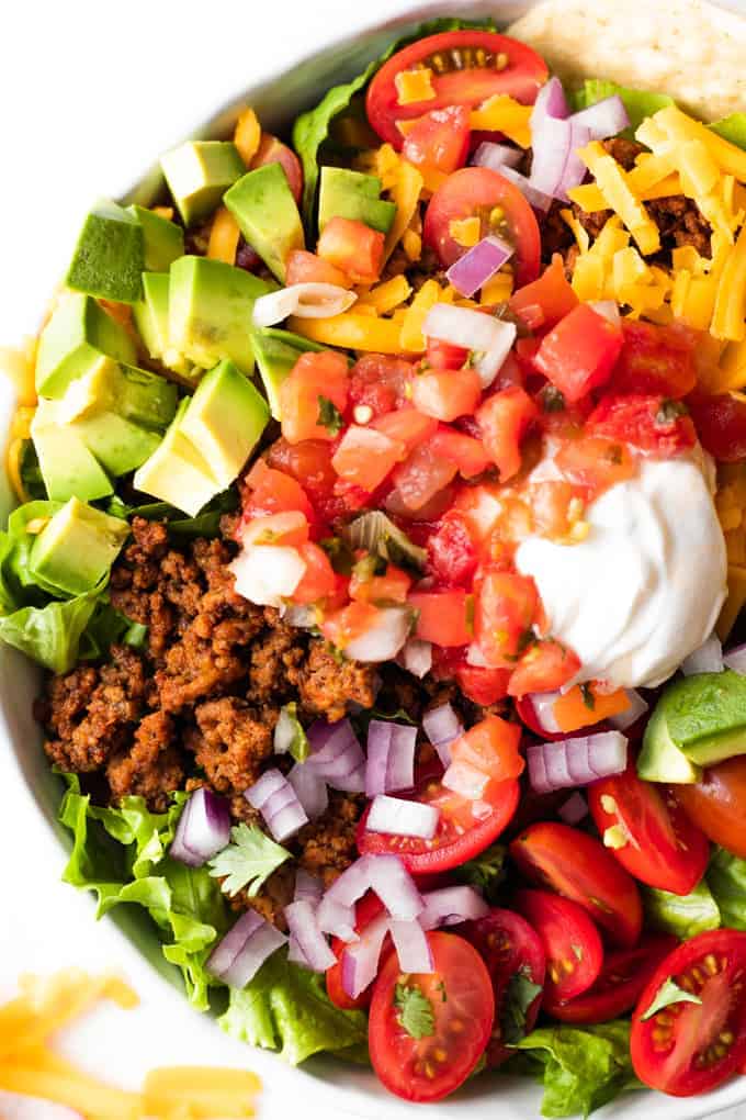 Taco Salad layered and ready to mix.