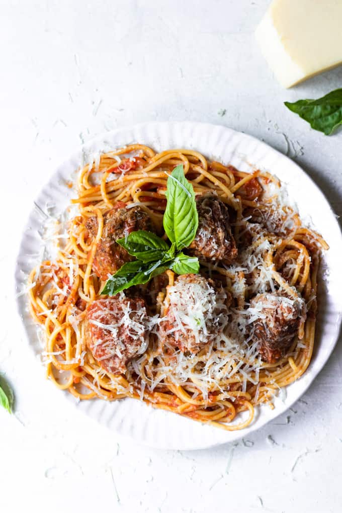 Plate filled with homemade spaghetti and meatballs.