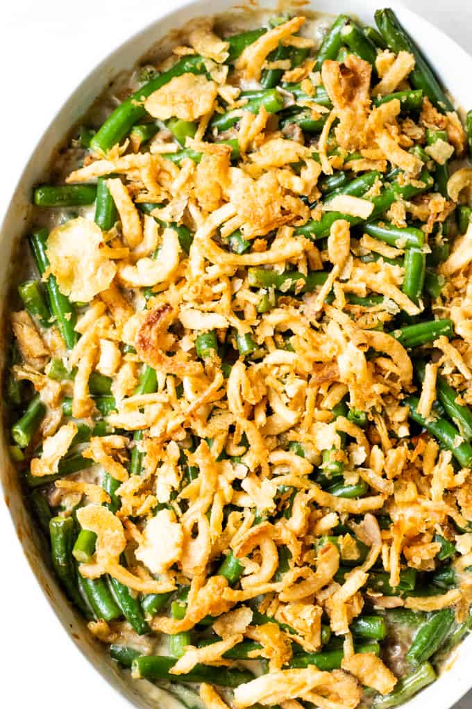 Green bean casserole in an oval baking dish.