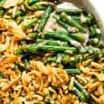 Casserole dish filled with baked green bean casserole.