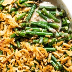 Casserole dish filled with baked green bean casserole.