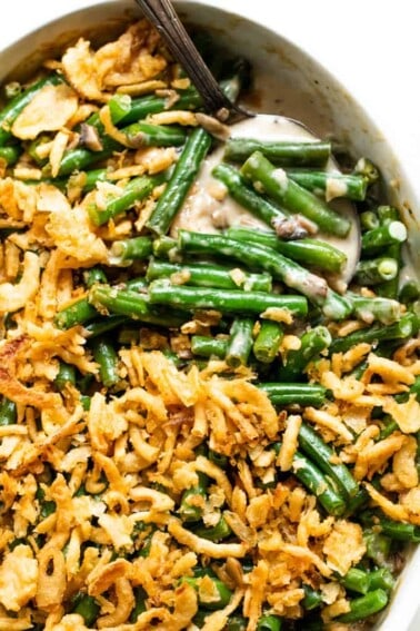 Casserole dish filled with baked green bean casserole.
