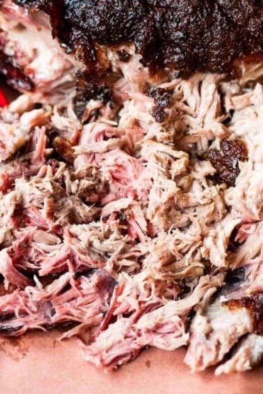 Bear claws shredding smoked pork.