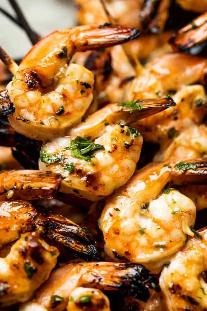 Up close view of shrimp on skewers after being grilled.