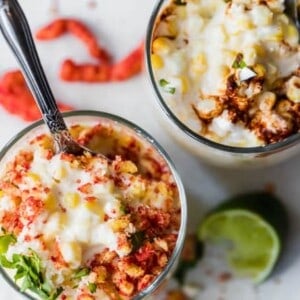 Overhead view of cups filled with mexican street corn.