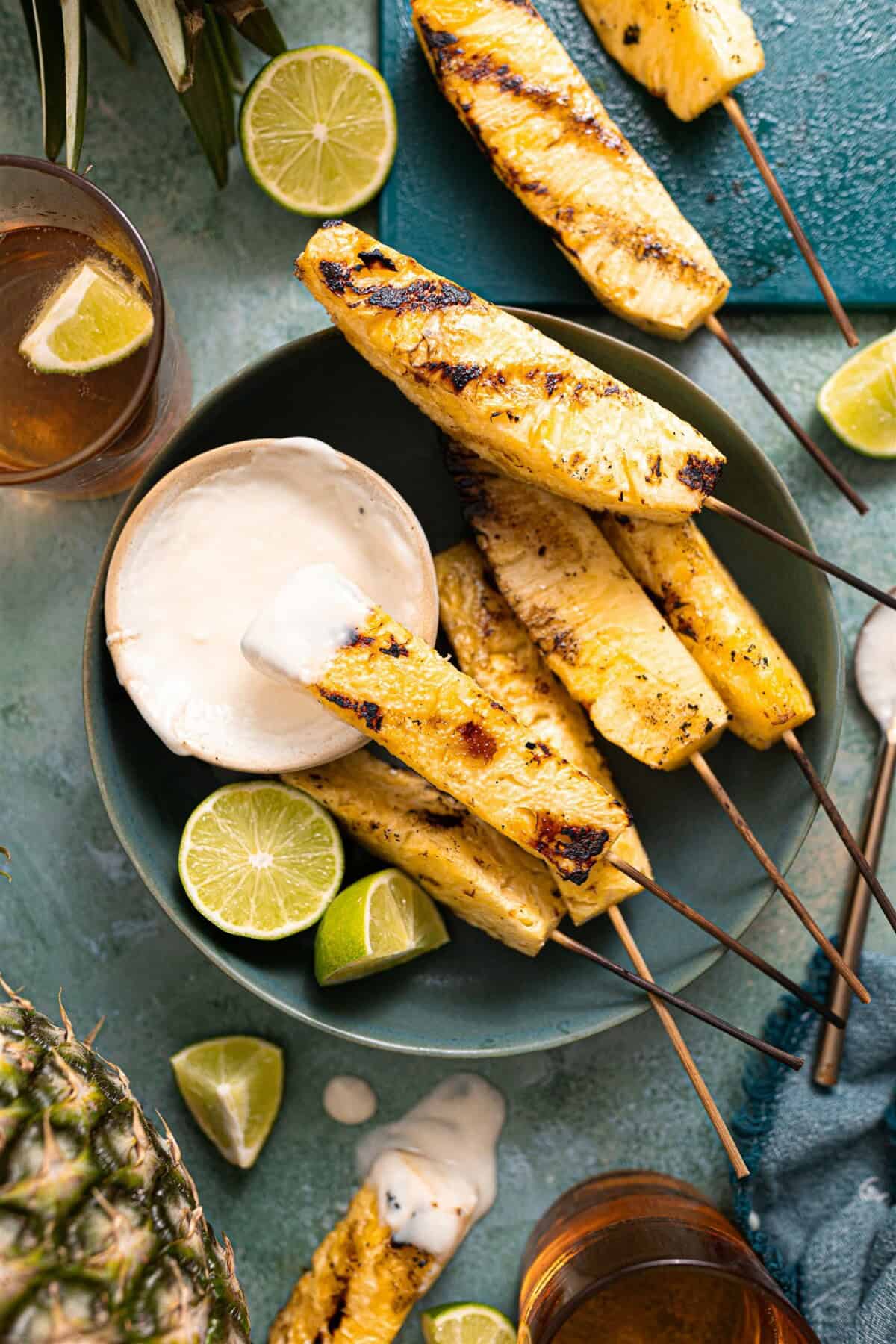 Grilled pineapple served with a coconut rum sauce. 