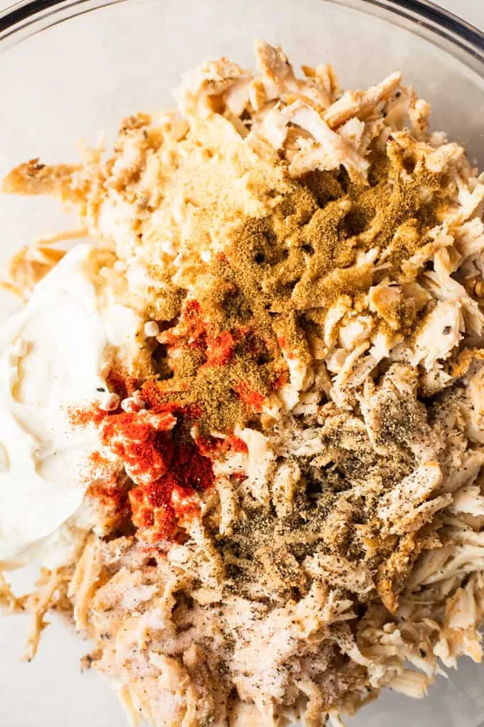 Shredded chicken, sour cream, and seasonings.